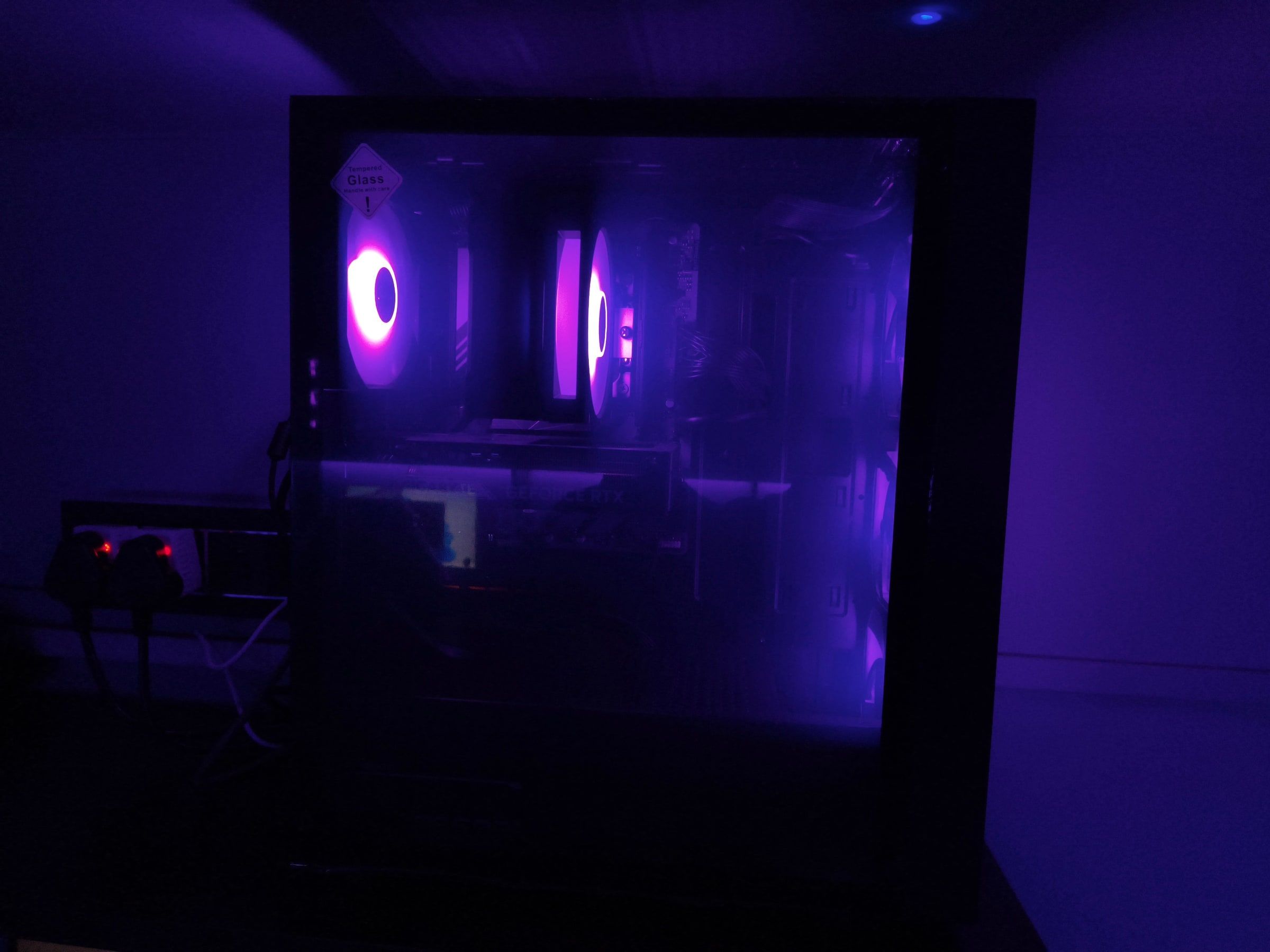 Inside one of Monarch's gaming PCs: purple-lit fans and the graphics card behind a glass side panel.
